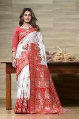 THIS EXQUISITE WORK OF ART IN BANARASI SILK FEATURES INTRICATE FLORAL DETAILS AND ZARI ON ALL FOUR SIDES SAREE