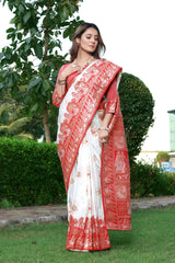 THIS EXQUISITE WORK OF ART IN BANARASI SILK FEATURES INTRICATE FLORAL DETAILS AND ZARI ON ALL FOUR SIDES SAREE