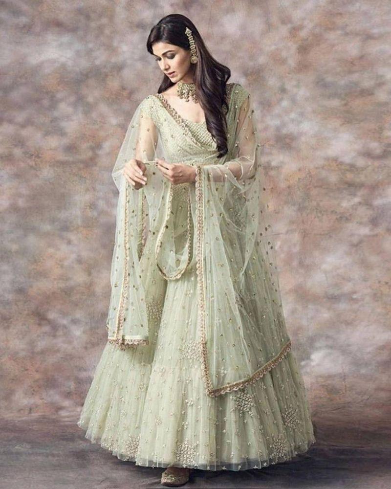 Light pista net embroidered designer lehenga choli