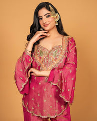 Royal elegance in this beautifully embroidered pink Sharara set.
