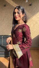 'Traditional Elegance: Woman in Maroon Embellished Salwar Kameez'