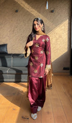 'Traditional Elegance: Woman in Maroon Embellished Salwar Kameez'